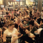 Breastfeeding in a shopping center and being removed. 200 others breastfeed in protest