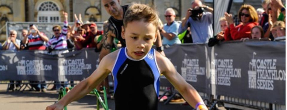 At 8 he challenges paralysis and competes in triathlon