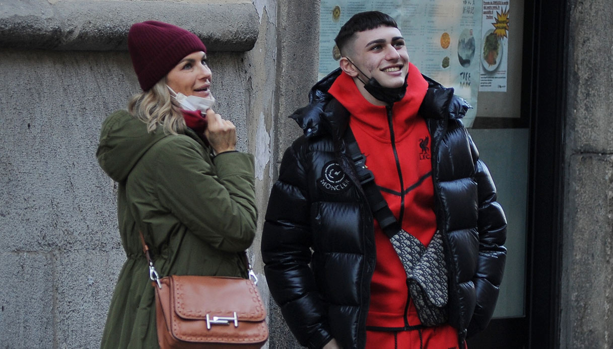 Martina Colombari and Achille Costacurta walking around Milan