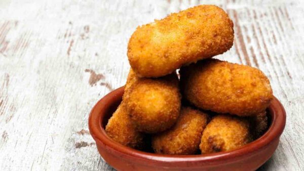 Potato croquettes stuffed with meat, frying has never looked so good
