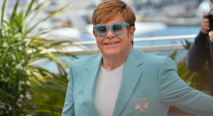 Why was singer Elton John hospitalized in France?