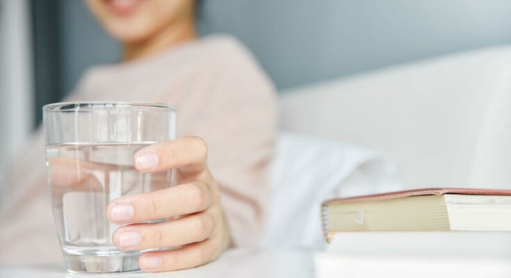 Why should you never leave a glass of water next to your bed?