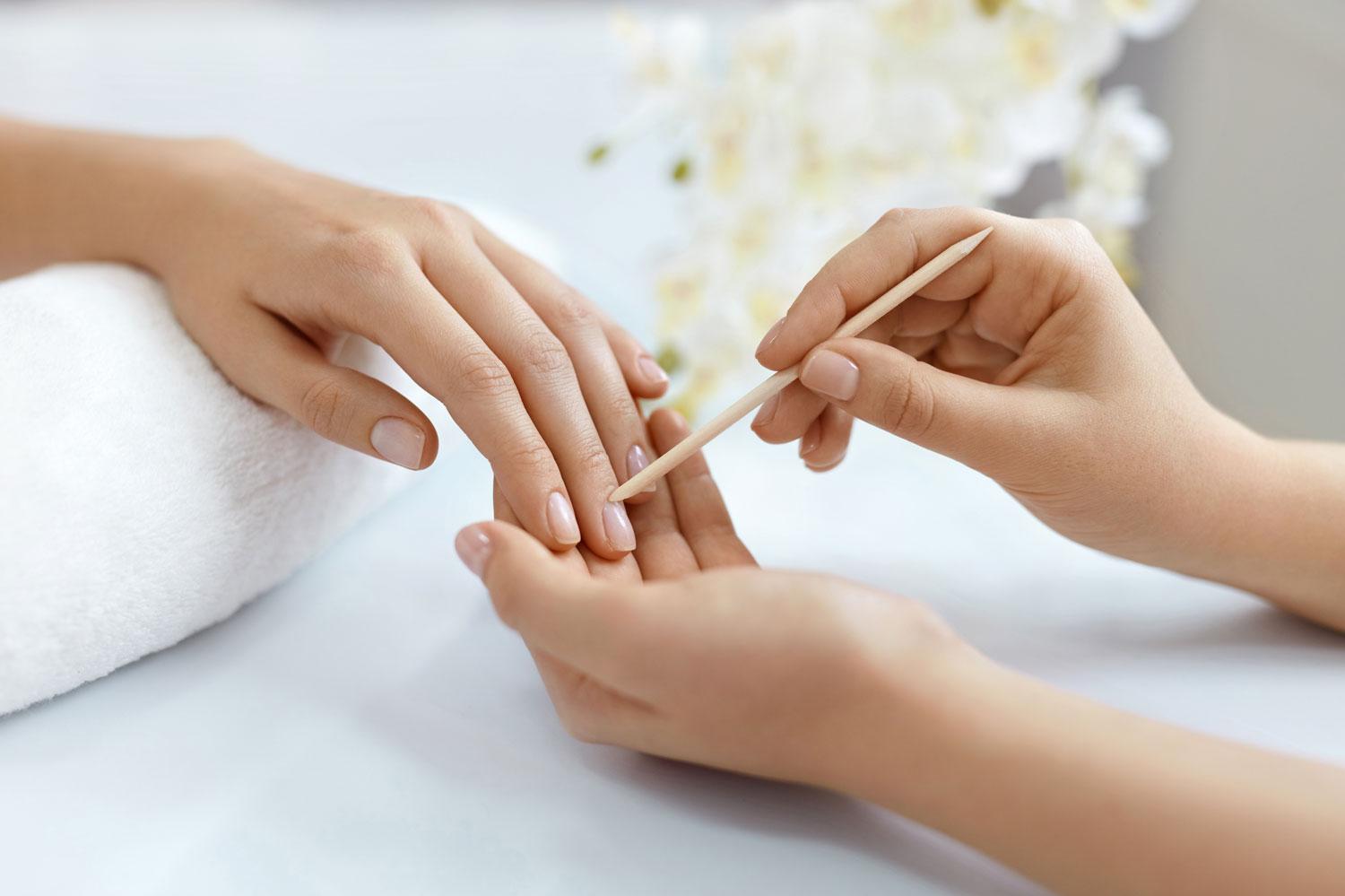 The cuticle can be removed in a gentle way —  using a special remover and wooden sticks